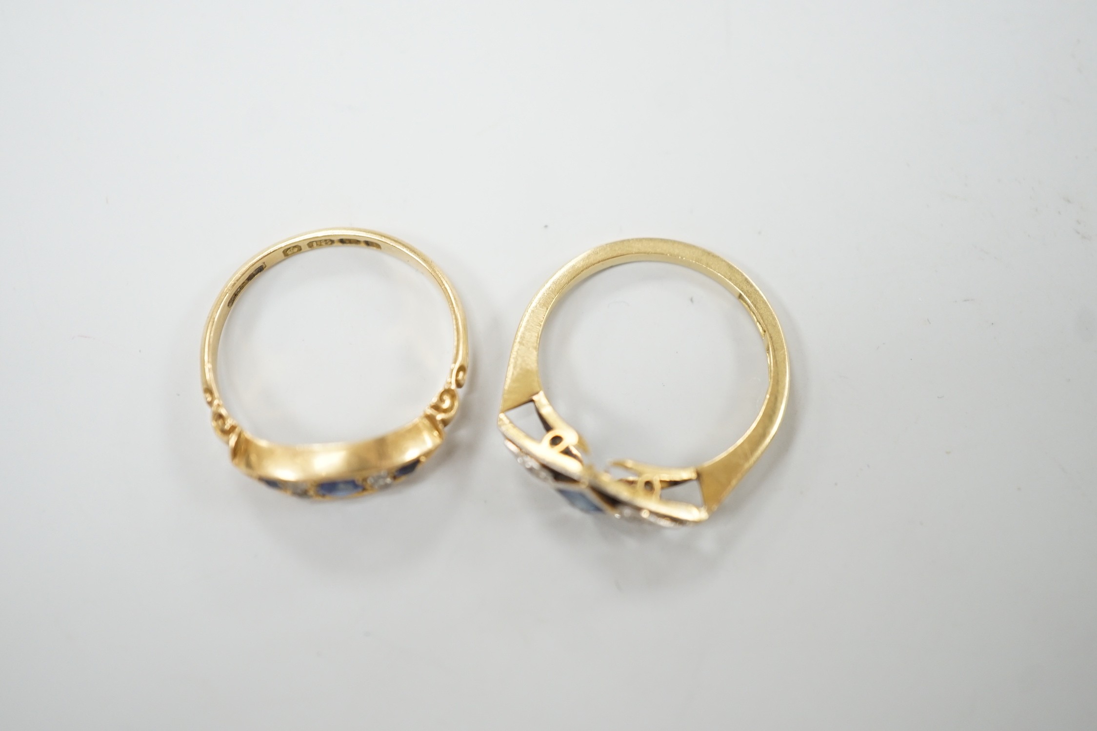 Two early 20th century 18ct, sapphire and diamond set rings, including Edwardian seven stone, size L and K/L